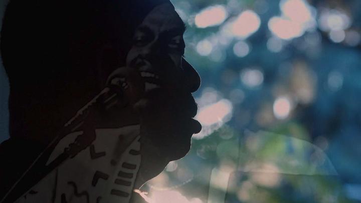 A still image from the film, This is Love, showing Rudy Love in shadowed profile