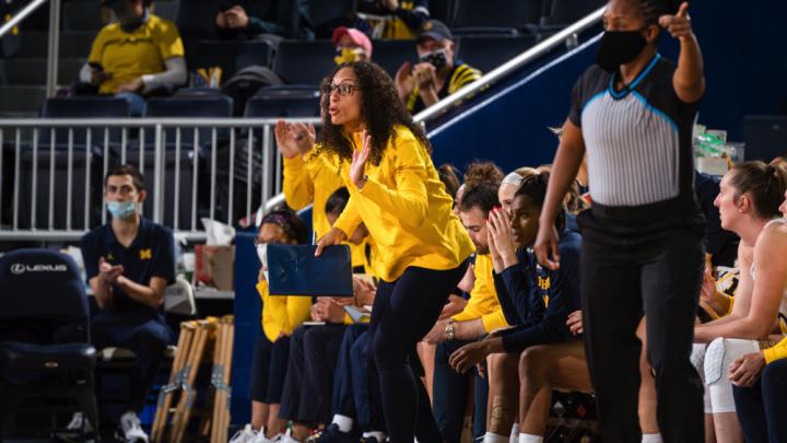 Carrie Moore on the sideline of a basketball game.