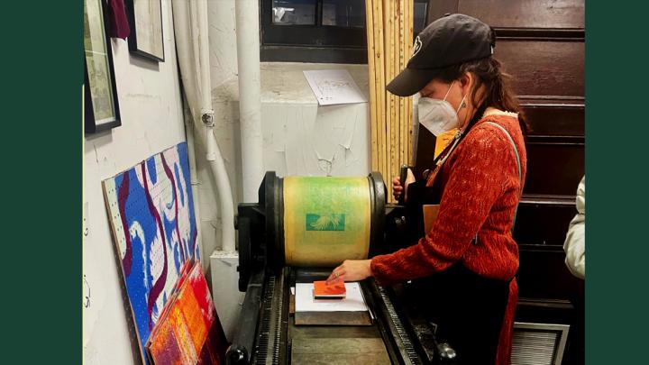 Photograph of Sarah Kariko ’90 operating a letterpress at the Bow & Arrow Press in Cambridge, Massachusetts