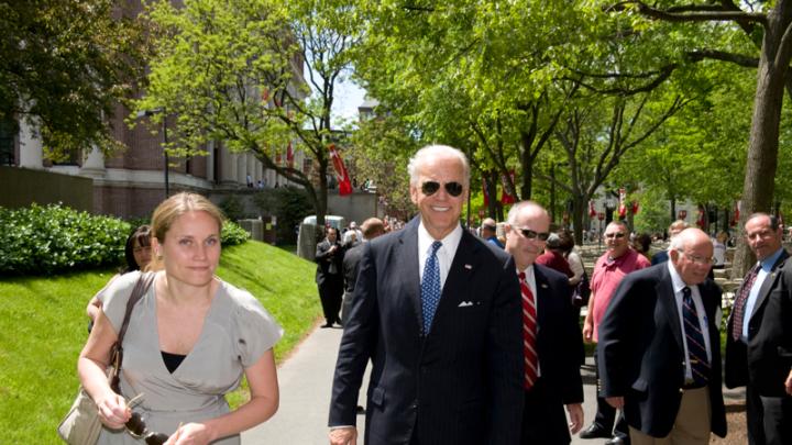 Biden walks with his former deputy press secretary, AnnMarie Tomasini, who is now director for intergovernmental relations in Harvard's office of public affairs and communications.