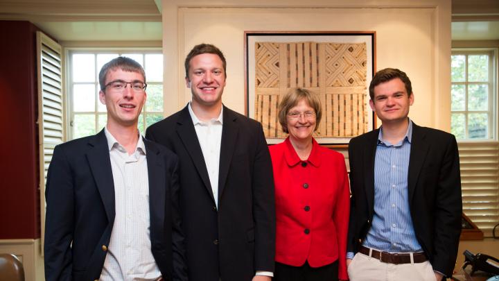 Harvard President Drew Faust greets the winners of the President's Challenge for social entrepreneurship in her office, in advance of the public announcement of their win. Florian Mayr '13 (from left), Matthew Polega '13, Drew Faust, and Scott Crouch '13 are pictured in Massachusetts Hall.