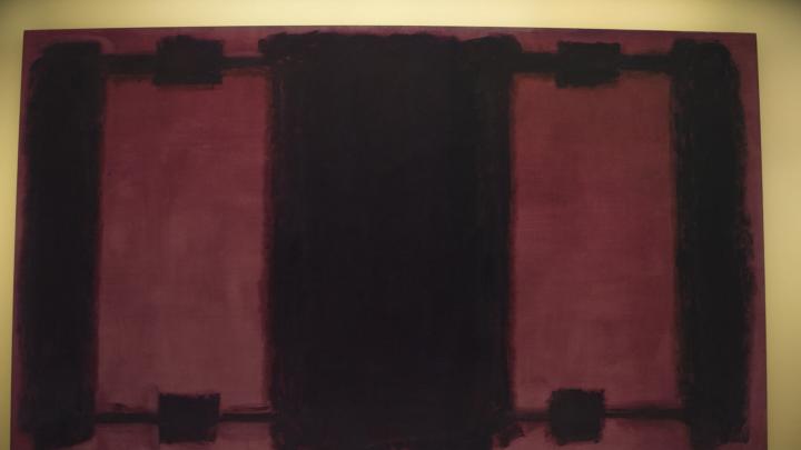 The background of Mark Rothko’s <i>Panel Four</i> exhibits different stages of color loss. The digital light projection technology illuminates the panel differentially, restoring the uniform original color.