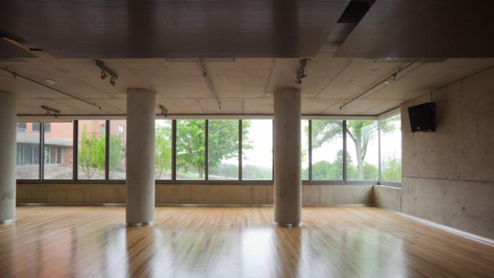 Windows let in light and rural views during yoga classes