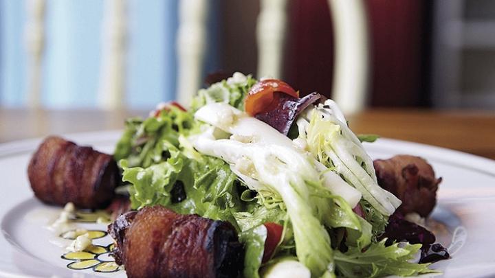 Tangy greens with bacon-wrapped dates