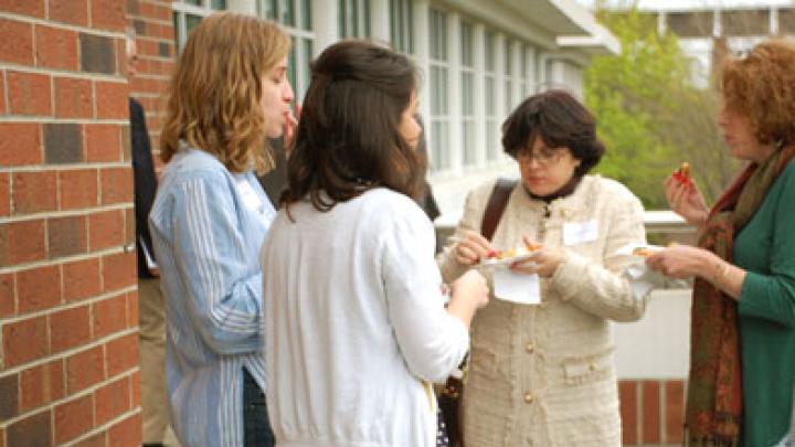 Guests on the outdoor patio overlooking Harvard Stadium.