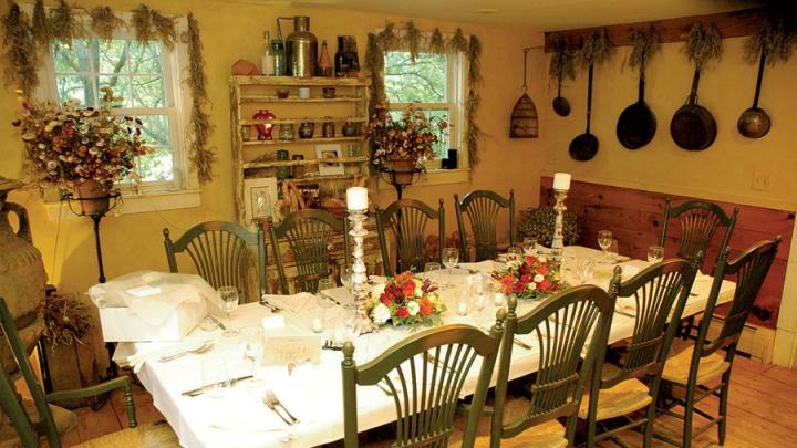 Meals are served at two communal tables in the restored barn.