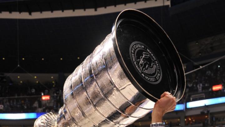 Photograph by Brian Babineau/Boston Bruins The Bruins' Don Sweeney '88 hoists the Stanley Cup.