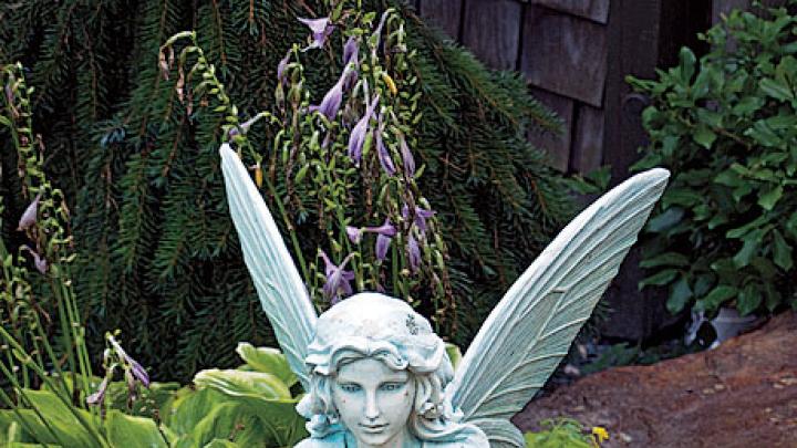 A statue of Titania holds a solar-powered orb.