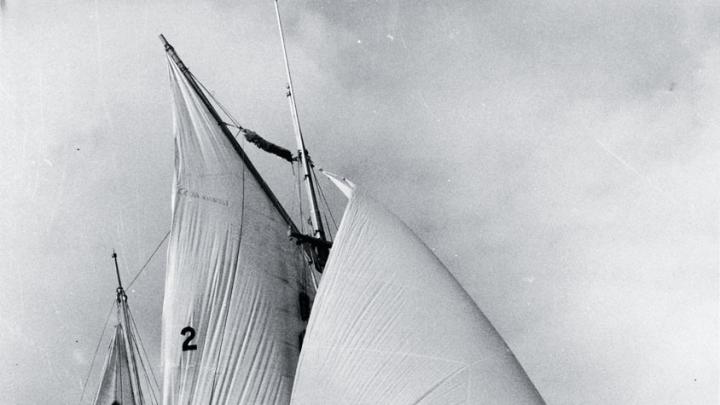 The 30-foot <em>Golden Rule</em> under sail, with James Peck &rsquo;36 and Willoughby visible 