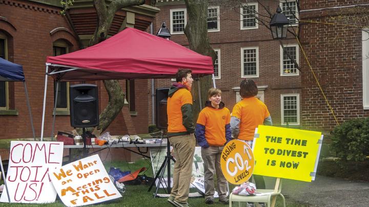 Advocates of divesting fossil-fuel investments protest at the president’s office at Massachusetts Hall.