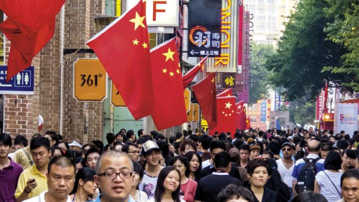China&mdash;both a Communist Party state and a consumer society (as in this holiday street scene in Guangzhou)&mdash;is also the setting for a billion-plus citizens&rsquo; pursuit of their own dreams. 