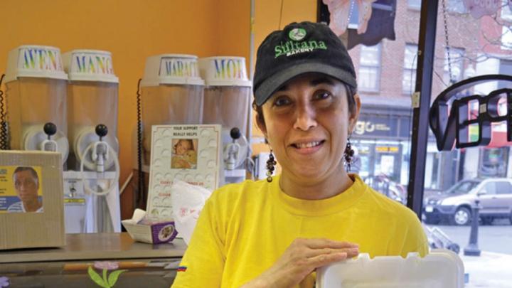 La Sultana Bakery sells cakes and pastries and has a savory breakfast and lunch buffet as well. Saleswoman Marleny Carmona proffers a plate of rice, stewed yuccas, shredded pork, and a beet salad with eggs, peas, and carrots.