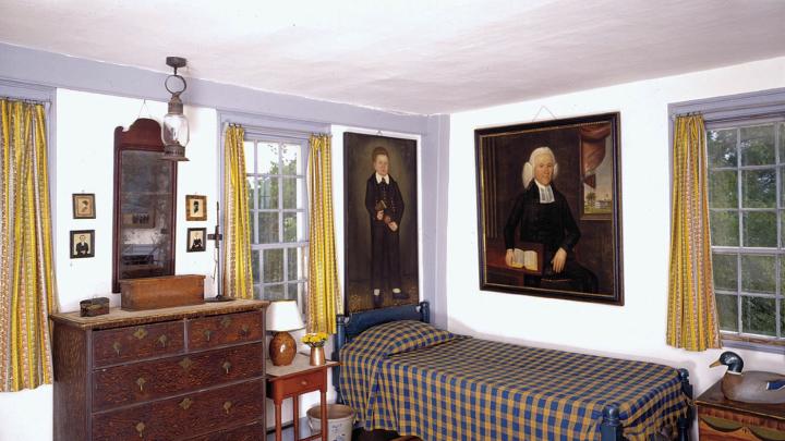A child&rsquo;s room includes imposing family portraits and a nineteenth-century hooked rug with an unusual leopard design