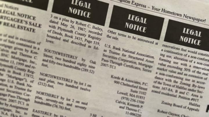 A page from a newspaper showing legal notices