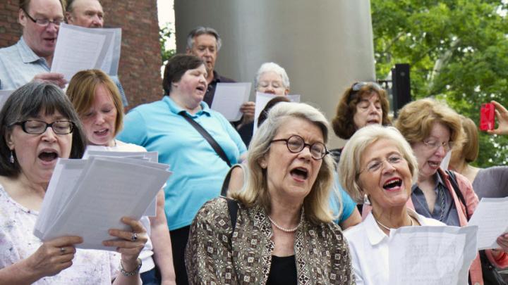Church members, including (from left) Christine Whiteside, Professor Diana Eck, and Sedgwick associate minister in the Memorial Church Dorothy Austin, gathered on the church steps on June 20 to greet the first truckload of organ parts with a hymn.