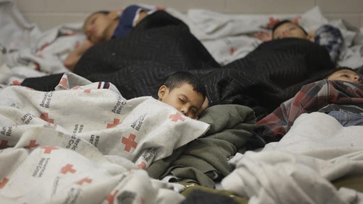 Detainees sleep in a holding cell at a U.S. Customs and Border Protection processing facility on Wednesday, June 18, 2014, in Brownsville, Texas. The CPB provided media tours that day of two locations in Brownsville and Nogales, Arizona, that have been central to processing the more than 47,000 unaccompanied children who have entered the country illegally since last October 1.
