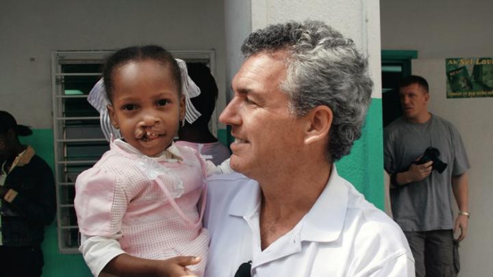 Brian Mullaney with a Haitian patient before her surgery this past February. Smile Train has provided roughly 160 surgeries in Haiti and recently launched “Cleft-free Haiti” to completely eradicate cleft there.