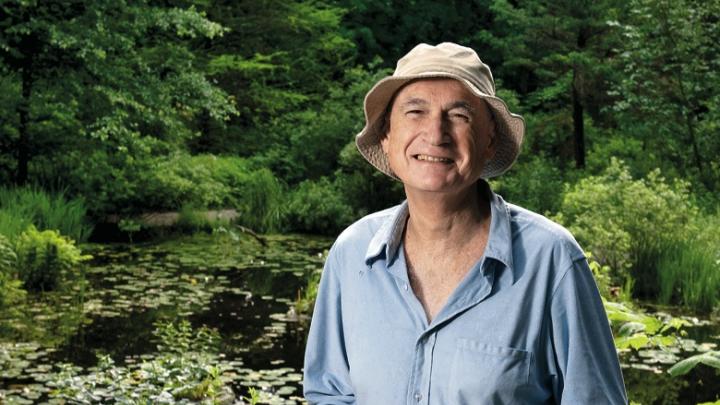 Volunteer guide Al Levin at the Lily Pond in Garden in the Woods