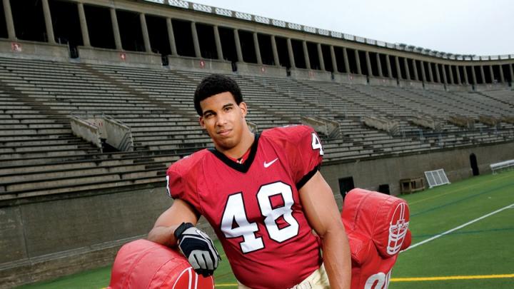 Defensive tackle Josue Ortiz with a blocking sled at Harvard Stadium