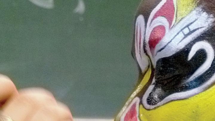 Detail of “Painting Faces of Beijing Opera,” by Christine Shen ’12, on display in lamont library