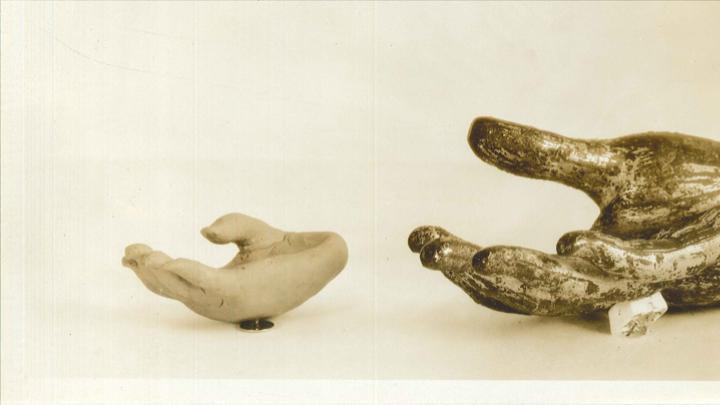 Photograph (c. 1935) of a fragment from a 12th–14th century Thai bodhisattva statue, along with the plasticene copy made by a pupil at the Perkins Institute who manually explored, and then copied, the hand.