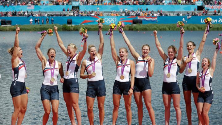 U.S. oarswomen Esther Lofgren ’09  (third from left ), who rowed in the #3 seat,  and Caryn Davies ’05 (second from right), who stroked the boat, celebrate with teammates after winning their Olympic gold medals.