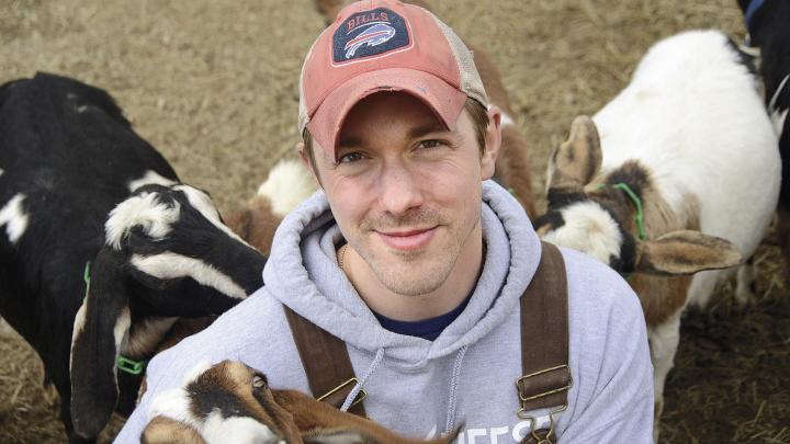 Max Sandvoss with some of his goats at the First Light Farm and Creamery in East Bethany, New York 