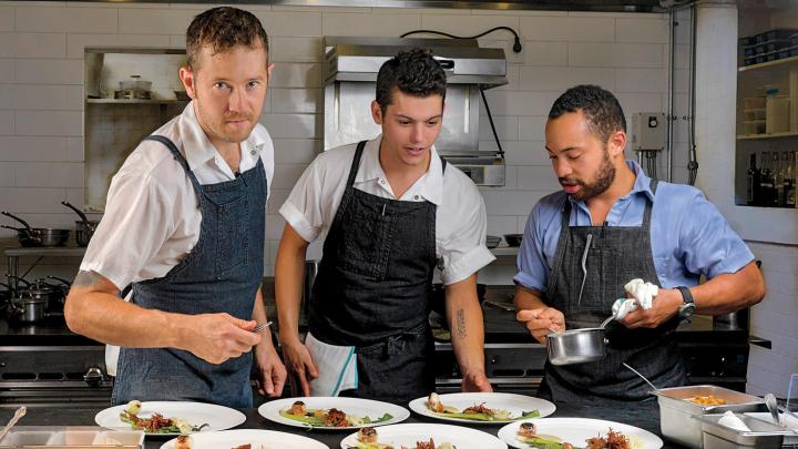 Chef/owner Alex Crabb shares the open kitchen with fellow cooks Tyson Wardwell and Nathan &ldquo;Lazer&rdquo; Phinisee.
