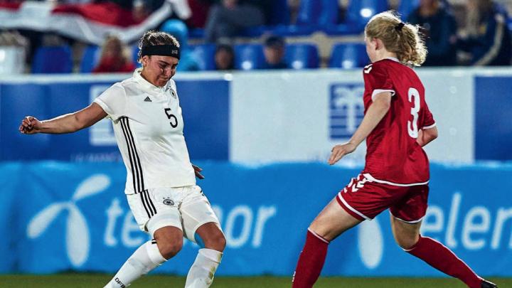 Linda Liedel (at left), representing Germany in Spain’s 2019 La Manga Tournament, competes for the ball with a Danish rival.