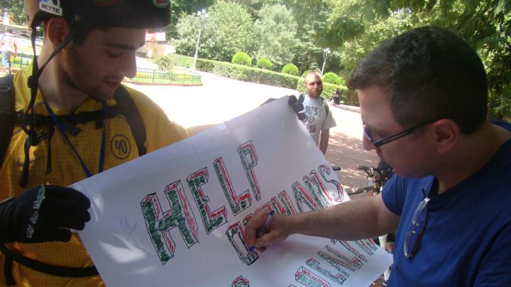 An ISS student gathers signatures in support of his team’s cause during a day-long fieldtrip to Tbilisi.