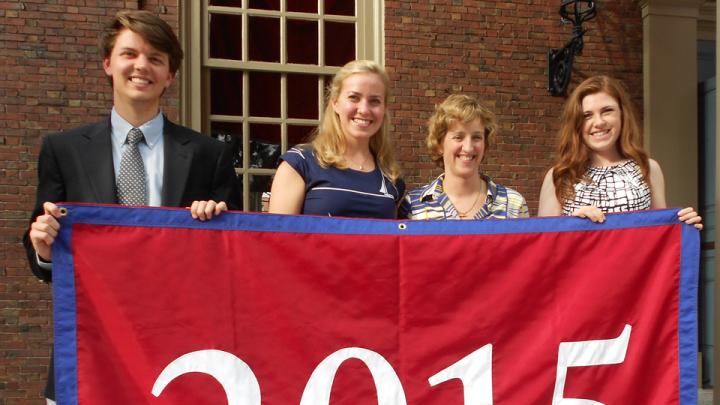Holding their blue-trimmed class banner, sophomore class Undergraduate Council representatives Chris Smiles (at left) and Ryley Reynolds flank Catherine Katz ’13 and associate dean of Harvard College Joan Rouse. Katz first proposed a sophomore class event to administrators. Smiles and Reynolds are also members of the Harvard Alumni Association’s Building Community Committee. 
