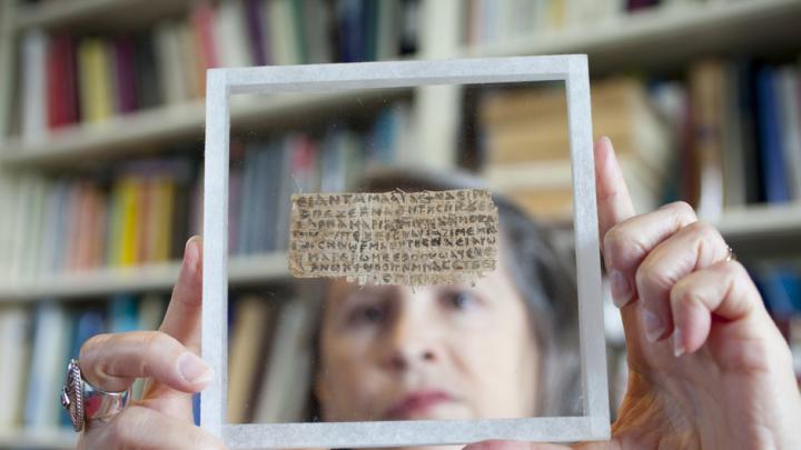 Hollis professor of divinity Karen L. King with the papyrus fragment on which is written the Gospel of Jesus's Wife.