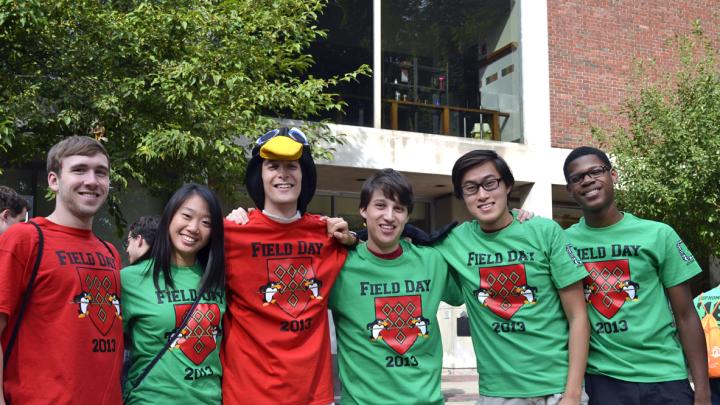 New Quincy House sophomores in green and veteran seniors in red (from left) Wes Welch, Kara Shen, Matthew Ackerman, Adam Al-Natsheh, Peter Lu, and Julian Guy are ready for Field Day in the O’Donnell Courtyard.