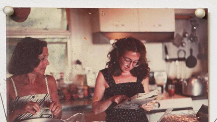 Undated snapshot of Marilyn Pappas and Jill Slosburg-Ackerman as younger women cooking together.