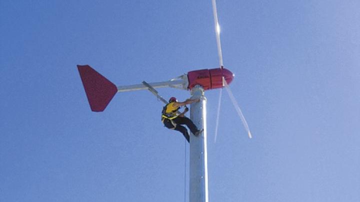 Two 10-kilowatt wind turbines generate renewable power atop the Soldiers Field parking garage.