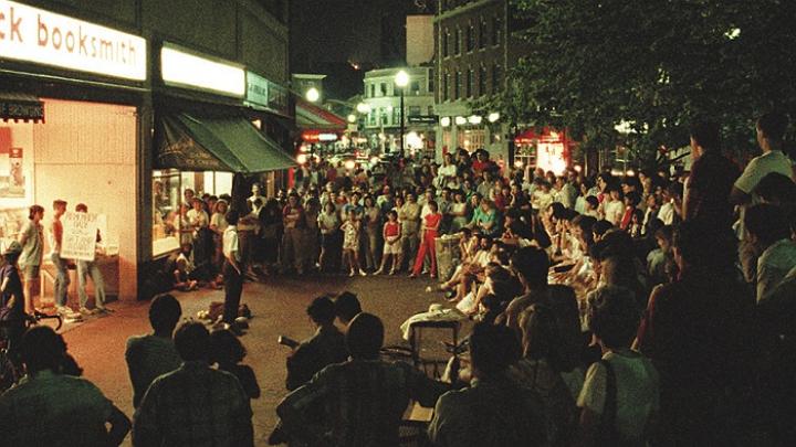 Cruising the Square: A summer crowd watches a street performer in 1987.