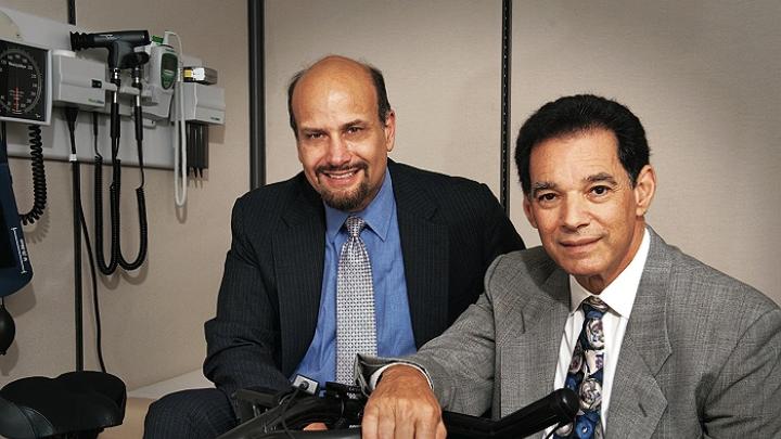 James Katz (left) and Bob Nadelberg with an indoor bicycle at their offices