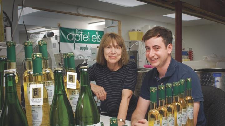 After their apple ice wine has fermented for three months, Margot and Leif Holtzman fill and seal each bottle by hand.