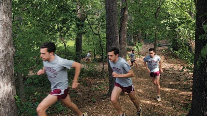 Cross-country captain Daniel Chenoweth  running hill repeats at Fresh Pond 