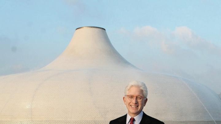 James Snyder stands in front of the exterior dome of the Israel Museum’s Shrine of the Book, which houses the Dead Sea Scrolls.
