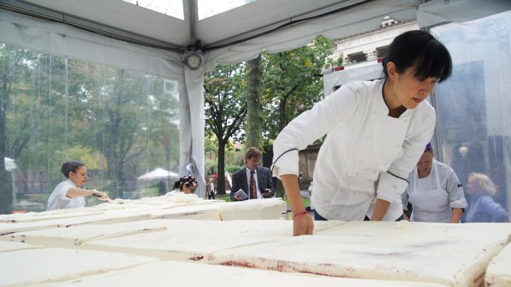 Chang works to align the sheets.