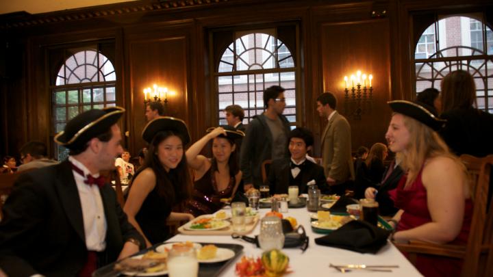 Students enjoy the historical menu in Adams House.