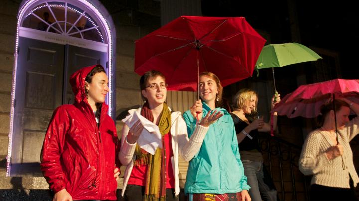 Student storytellers on the steps of University Hall had trouble making themselves heard over the rain.