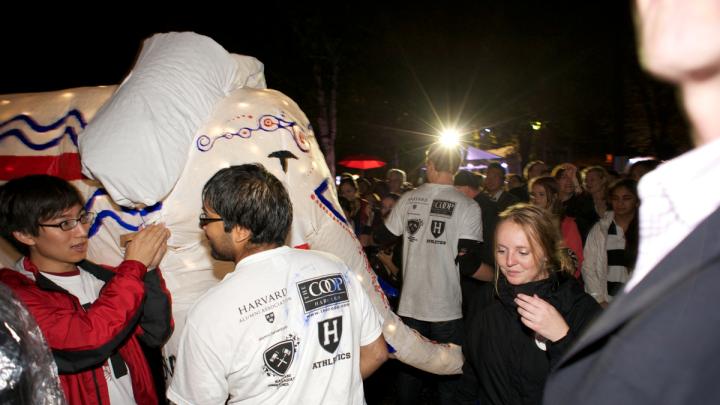 Students (including the author, in Crimson jacket) take the elephant through the parade in Harvard Yard.