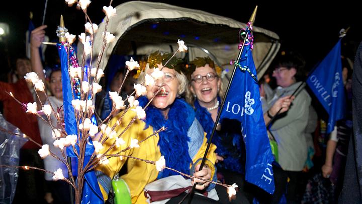 Lowell House co-masters Dorothy Austin and Diana Eck were carried by House residents in a rickshaw as part of the parade.