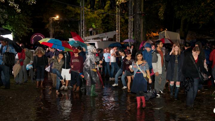 When the safety announcement was made, partygoers wondered whether it was more hazardous to stay outside in a lightning storm or to navigate the flooded Yard to make their way inside.