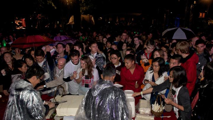 The crowds were appeased after receiving their "precious bricks" of red velvet cake.