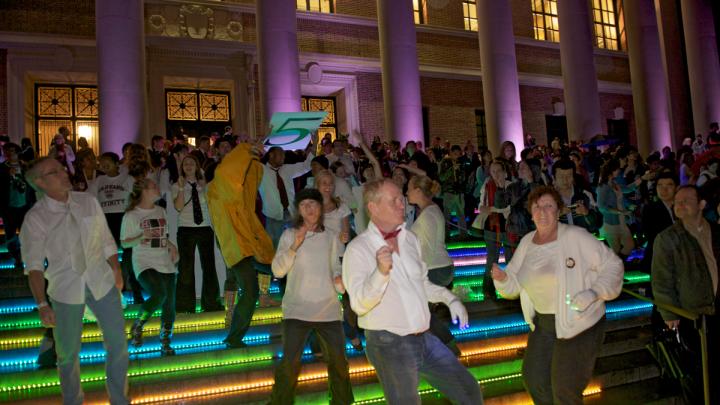 To get the evening's dancing started, a "flash mob" of dancers performed a choreographed routine they'd rehearsed throughout the previous week. The dancers were on the steps of Widener Library and at other Yard locations. Colorful LED lighting decorated buildings around the Yard.