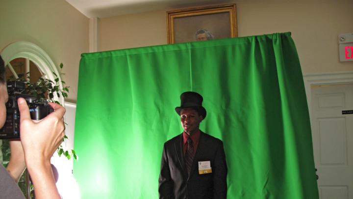 A student poses in the Dudley House photobooth.