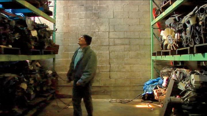 Joe, a quintessential New Yorker and central figure in <i>Foreign Parts,</i> takes a walking tour of a warehouse stocked with automobile parts.